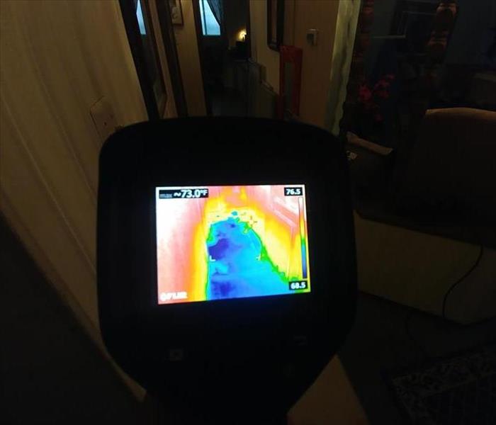 picture of thermal camera showing a lot of water in same hallway 