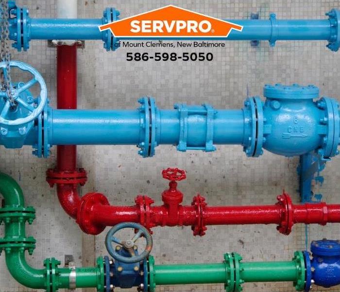 Colorful industrial pipes are shown.