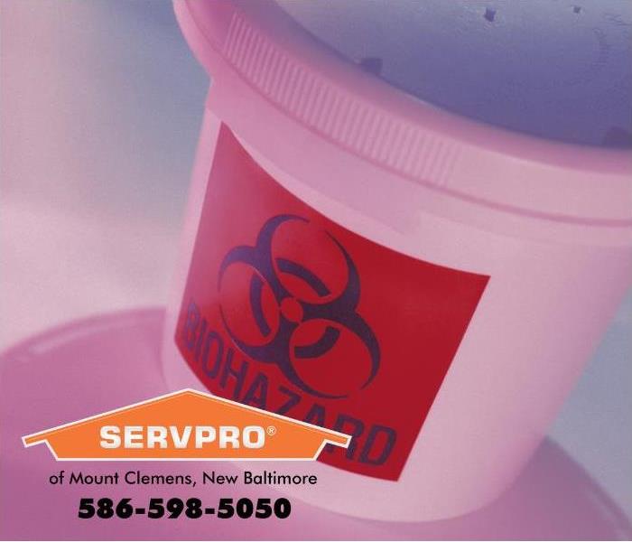 A biohazard sign is visible on a container.