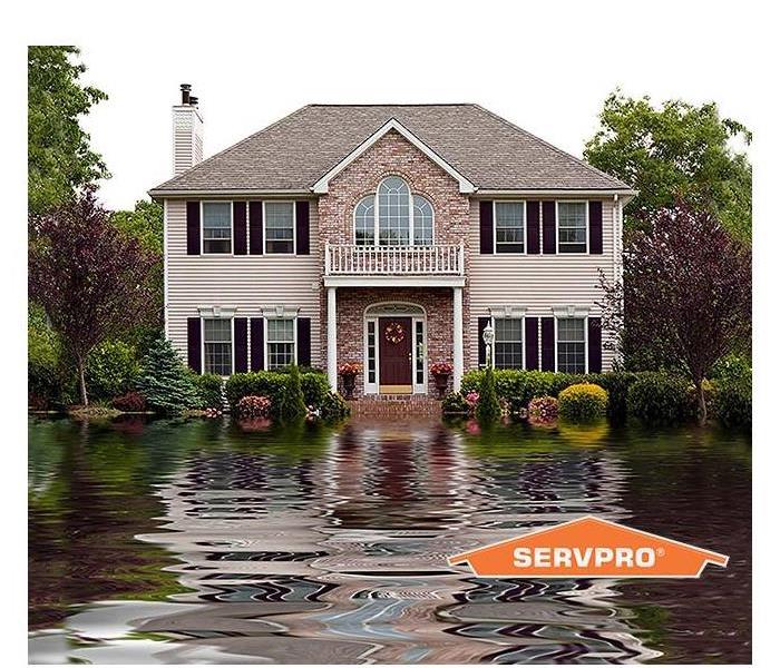House going under flood waters